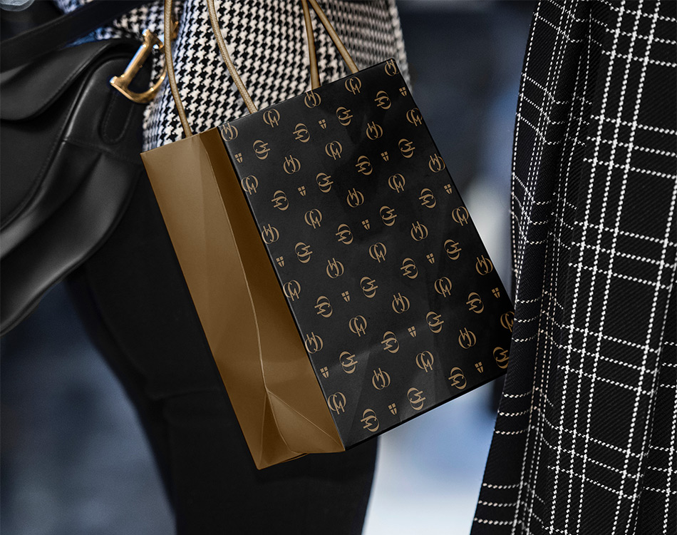 Stylish woman carrying a Grand Palais branded shopping bag